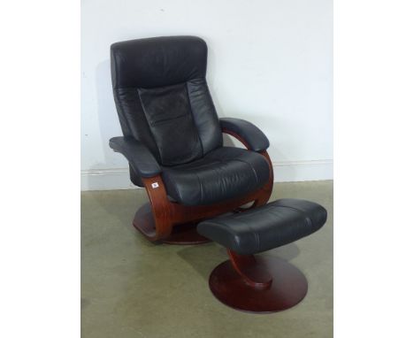 A modern leather adjustable chair with foot stool