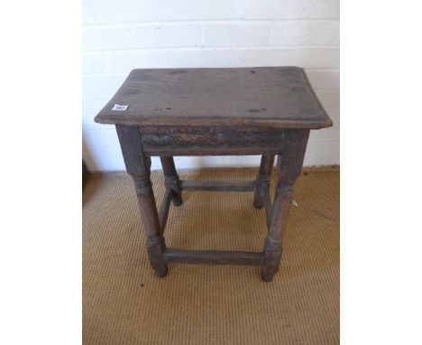A 17th century oak joint stool with a carved frieze - Height 61 cm x 48 cm x 29 cm 