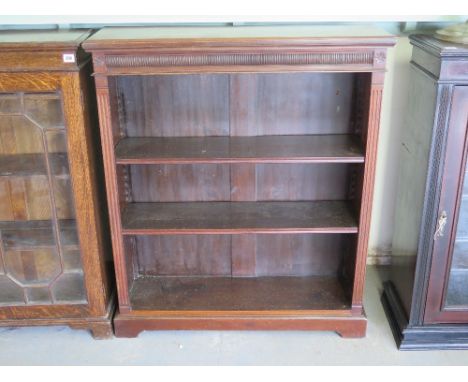 A Victorian open bookcase, carved relief detail to top over three shelves raised on bracket supports - 91 cm x 27 cm x 107 cm