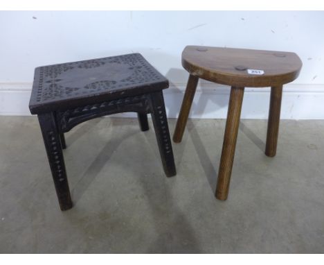 A carved small stool together with a three legged 19th century milking stool