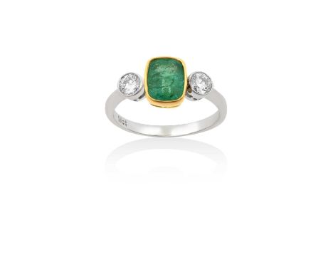 An Emerald and Diamond Three Stone Ringthe cushion shaped emerald in a yellow rubbed over setting, flanked by round brilliant