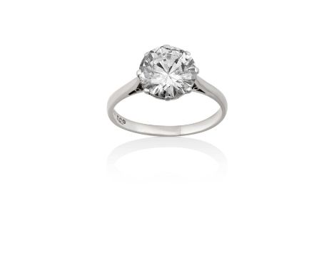 A Platinum Diamond Solitaire Ringthe round brilliant cut diamond in a claw setting, to a tapered shoulder plain polished shan