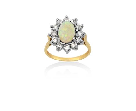 An 18 Carat Gold Opal and Diamond Cluster Ringthe oval cabochon opal within a border of round brilliant cut diamonds, in whit