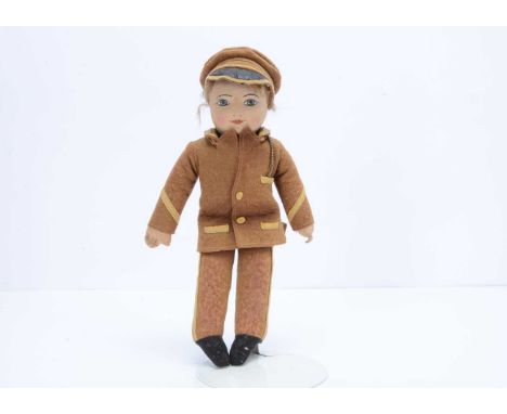 A Chad Valley GWR railways doll, 1930s, with pressed cloth face, painted features, remains of mohair wig, unjointed, original