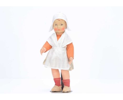 A small Bing cloth Dutch girl doll,  with painted head, light brown eyes, brown painted hair, swivel head, jointed limbs, ori