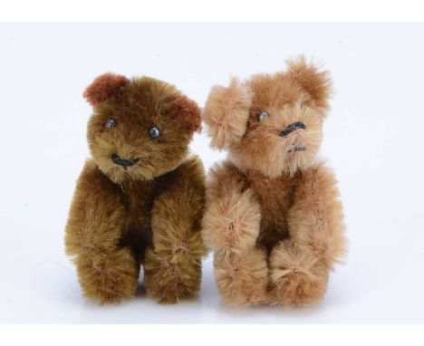 Two post-war Schuco miniature teddy bears,  one with dark golden brown mohair the other with light brown mohair, black boot b