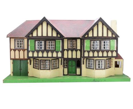 A large Tri-ang No.93 stockbroker dolls’ house, 1950s, with red painted roof, cream painted with stained timbers, tinplate wi