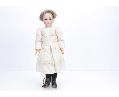 A Simon & Halbig for Kammer & Reinhardt child doll,  with brown sleeping eyes, brown mohair wig, pierced ears, jointed compos