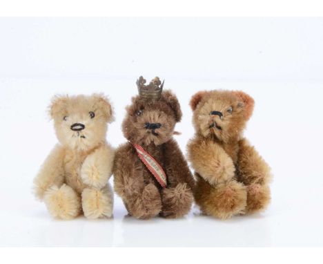 Three post-war Schuco miniature teddy bears, all with black pin eyes, black stitched nose and mouth and metal framed jointed 
