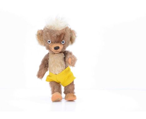A rare Merrythought Punkinhead teddy bear, circa 1951, with brown mohair, clear and black glass eyes with white painted backs
