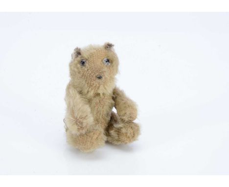 A Farnell WW1 'soldier' teddy bear, with blonde mohair, clear and black glass eyes, remains of black stitched nose, pipe clea