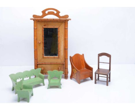 A French faux bamboo doll’s wardrobe,  with mirrored door and drawer —19 ¼in. (49cm.) high, a green painted sofa and two chai