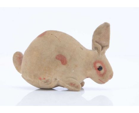 A Steiff velvet rabbit, circa  1908, of white velvet with brown painted spots, black glass bead eyes, pink stitched nose and 