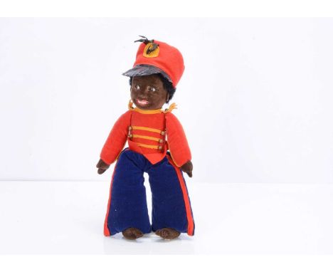 A 1930s Chad Valley black marching band leader,  with pressed brown velvet head, hands and feet, inset brown and white glass 