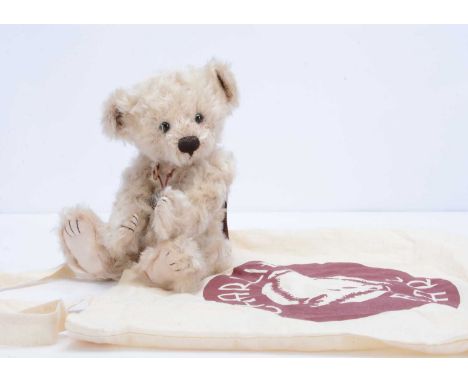 A Charlie Bears limited edition Scooter teddy bear, 1141 of 1200, designed by Isabelle Lee, with light brown curly plush, car