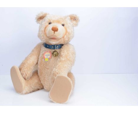 A large Steiff limited edition Teddy Baby 1949 replica, 430 of 1500, blue leather collar, with certificate —29 ½in. (75cm.) h