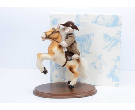 A Steiff limited edition Rough Rider,  409 of 1858, cream alpaca fur teddy bear, modelled as a US  cavalry rider, on wooden p