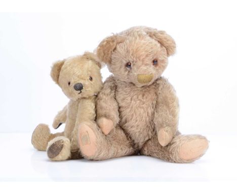 Two Chad Valley teddy bears, the larger with long light brown  mohair, orange and black glass eyes, brown stitched nose and l