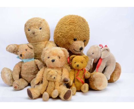 Various post -war teddy bears and soft toys, including a Steiff elephant with button, two large Eastern European art silk ted