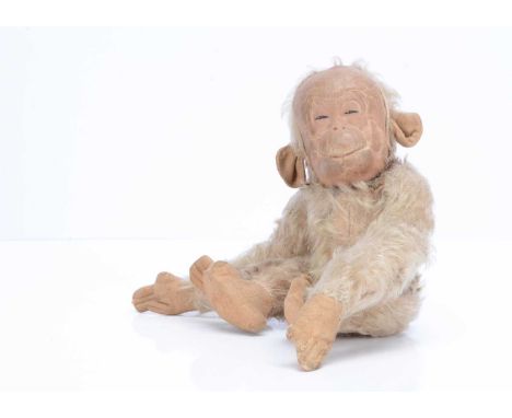 A Merrythought Jubilee Monkey soft toy, with brown tipped blond mohair, moulded and painted oil cloth face, brushed cotton ea