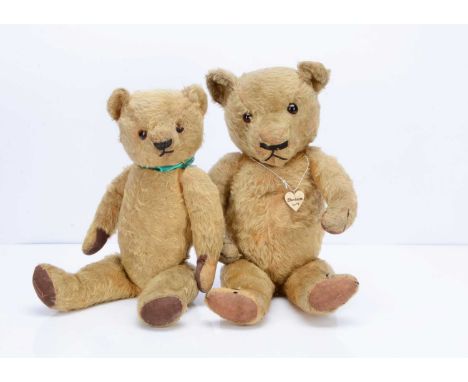 Two 1930s Chad Valley Magna teddy bears,  the larger with golden mohair, orange and black glass eyes, black horizonal stitche