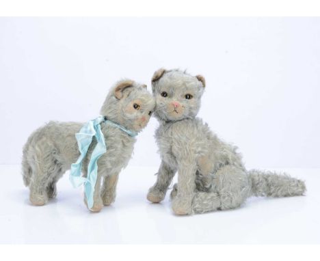 Two post-war Merrythought Marvellous cats, Persian styled cats, the seated with blue mohair,  inset green and black glass eye