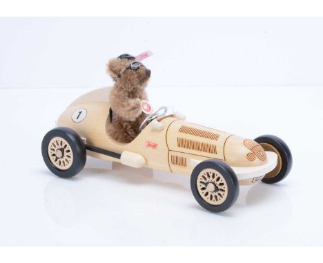 A Steiff limited edition Teddy bear with Silver Arrow Mercedes Car, 1178 of 1500, caramel mohair bear —4 ¾in. (12cm) high; an