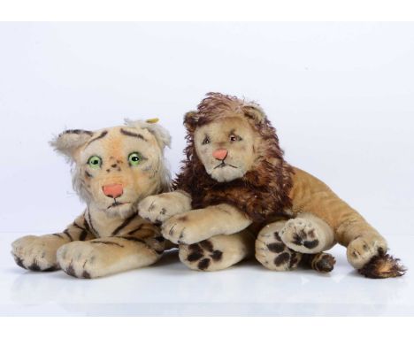Two post-war Steiff wild cat soft toys,  a Leo lion with card tag and a 1959-1964 yellow tag tiger cub —19in. (48cm.) long