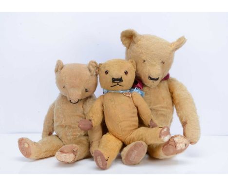 Three 1930s Chad Valley teddy bears,  the largest, with golden mohair, black stitched horizonal nose, swivel head, jointed li