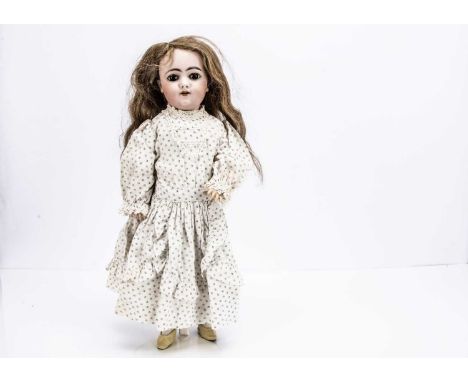A Simon & Halbig 1029 child doll, with brown lashed sting pulled sleep eye mechanism, dark brows, pierced ears, original ligh