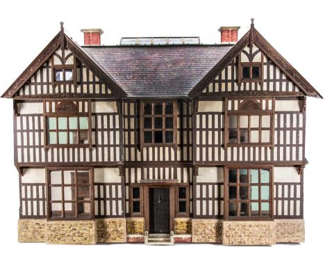 A fine and large Anglo-Indian dolls’ house by Sidney Brakspear, circa 1929, Indian mock-tudor in style, with individual card 
