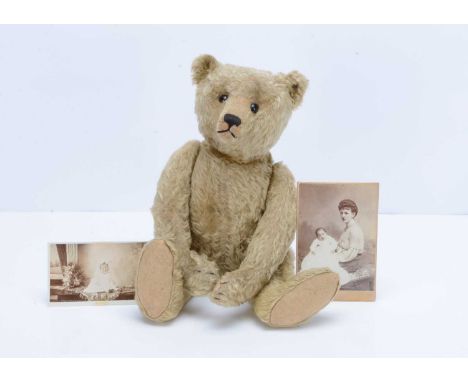 A fine early Steiff teddy bear, circa 1906 with provenance, with light golden mohair, black boot button eyes, pronounced clip