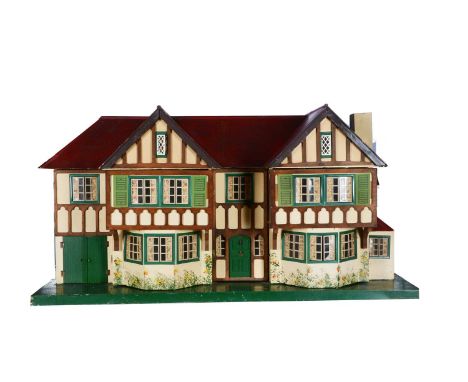 A large Tri-ang No.93 stockbroker dolls’ house, 1950s, with red painted roof, cream painted with stained timbers, tinplate wi