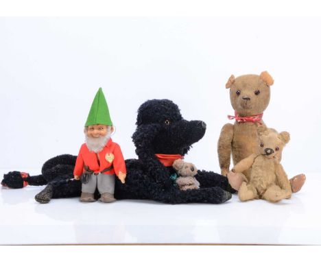 A small 1930s Chad Valley teddy bear,  with blonde mohair, orange and black glass eyes, black stitched nose, swivel head and 
