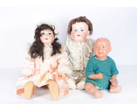 Two bisque headed dolls,  an Ernst Heubach 302 child doll with brown sleeping eyes, dark brown nylon wig, jointed composition