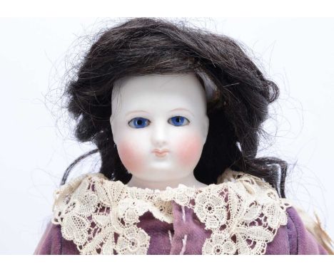 A French bisque shoulder-head fashion doll,  with fixed blue glass eyes, black eyeliner, fine light brown brows, delicately p