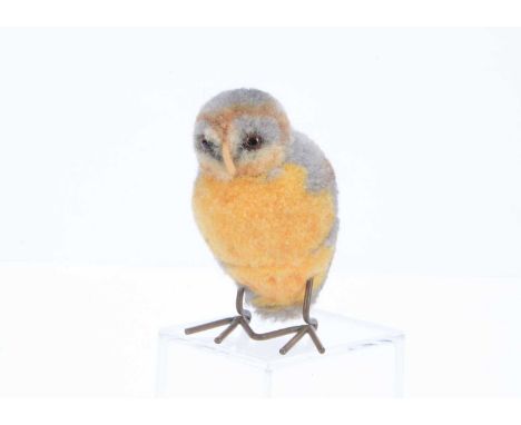 A rare Steiff woollen pom-pom owl, 1934-39,  grey and yellow wool,  brown and black glass eyes, felt beak, swivel head and me