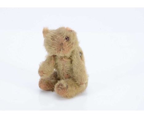 A Farnell WW1 'soldier' teddy bear, with golden mohair, orange and black  glass eyes, pipe cleaner ear, swivel head and pin-j