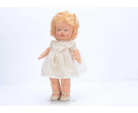 A fine Chad Valley Toddler cloth doll, late 1930s, with pressed felt face, blue painted side glancing eyes, blonde mohair wig