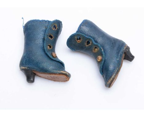 A pair of fashion doll’s heeled boots, of blue leather with brass buttons, soles impressed R o —2 ¼in. (5.5cm.) high