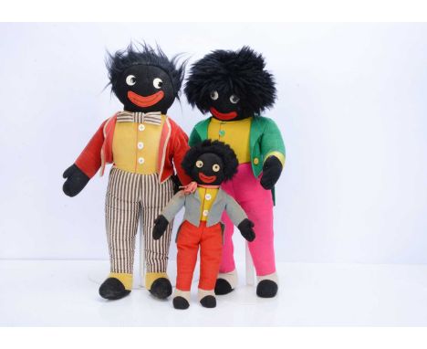 Two Merrythought Gollys, the smaller 1930s with floating pupil eyes, red felt mouth, fixed head with possible arms, integral 