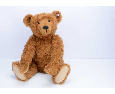 A large Steiff limited edition 1906 replica red-brown mohair teddy bear, 450 of 1906, with certificate —27 ½in. (70cm.) high 