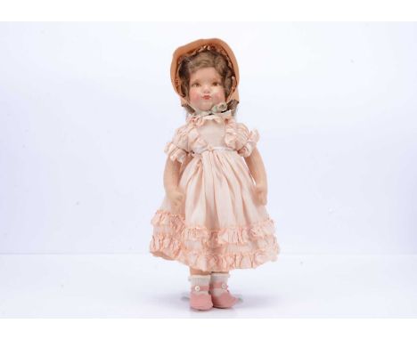 A post-war Dean’s Rag Book Co girl doll,  with painted composition head, brown transfer printed eyes, light brown mohair wig,