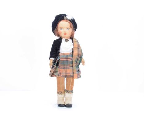 A 1930s Chad Valley Scottish girl doll, with press brushed cotton face, blue painted eyes, brown mohair wig, swivel head, cot