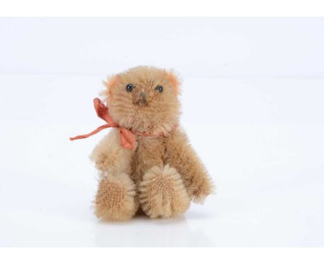 A fine Farnell WW1 'soldier' teddy bear, with golden mohair, black glass eyes, pipe cleaner ears, swivel head and pin-jointed