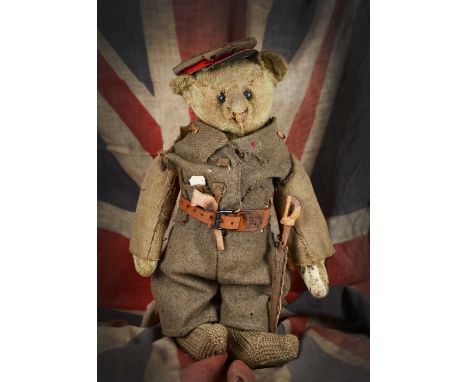Captain Bruiny, a rare Steiff teddy bear, circa 1908, home dressed in 1st World War British uniform and provenance,  with lig