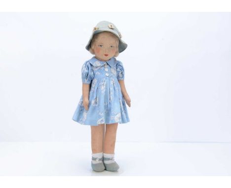 A 1930s Chad Valley girl doll, with pressed brushed cotton face, blue painted eyes and features, blonde mohair wig, swivel he