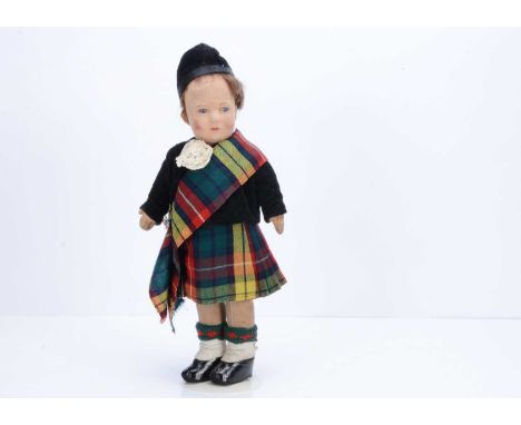 A Chad Valley Scottish boy, 1930s,  with pressed felt face, blue and white glass eyes, brown mohair wig, swivel head, jointed