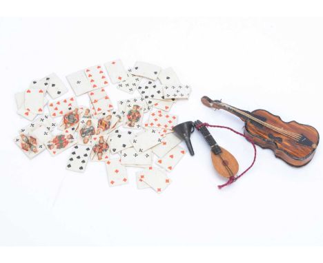 An 19th century cardboard sweet box in the form of a cello,  wood grained with strings, opening at the back —3 ¾in. (9.5cm.) 