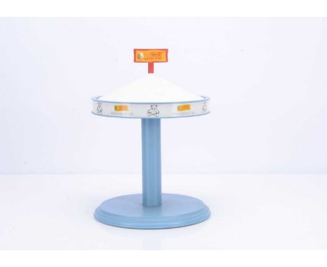 A Steiff Collection counter display  carousel,  painted blue and  white with Steiff yellow and red sign to top —14 ½in. (37cm